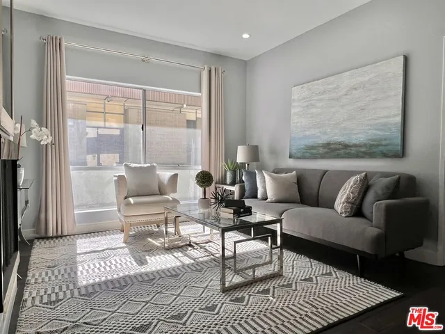 a living room with furniture and a rug