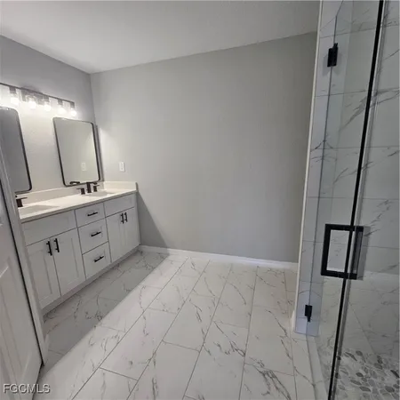 a bathroom with a shower and a toilet