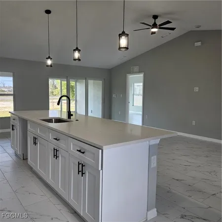 a kitchen with stainless steel appliances granite countertop a sink and dishwasher