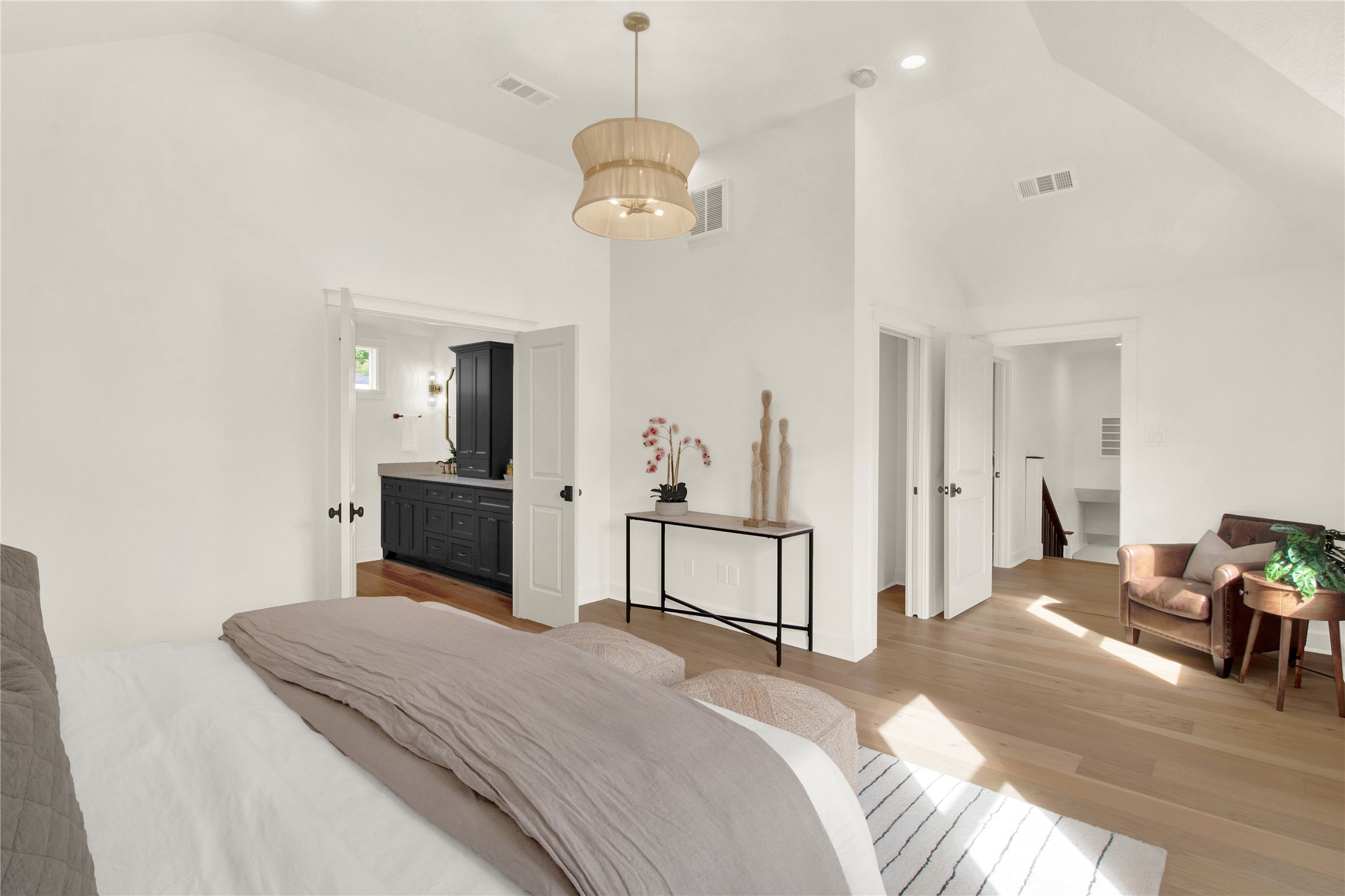 1535 Rutland Street Houston, TX 77008 - Photo 27 of 50 a spacious bedroom with a bed and a chandelier