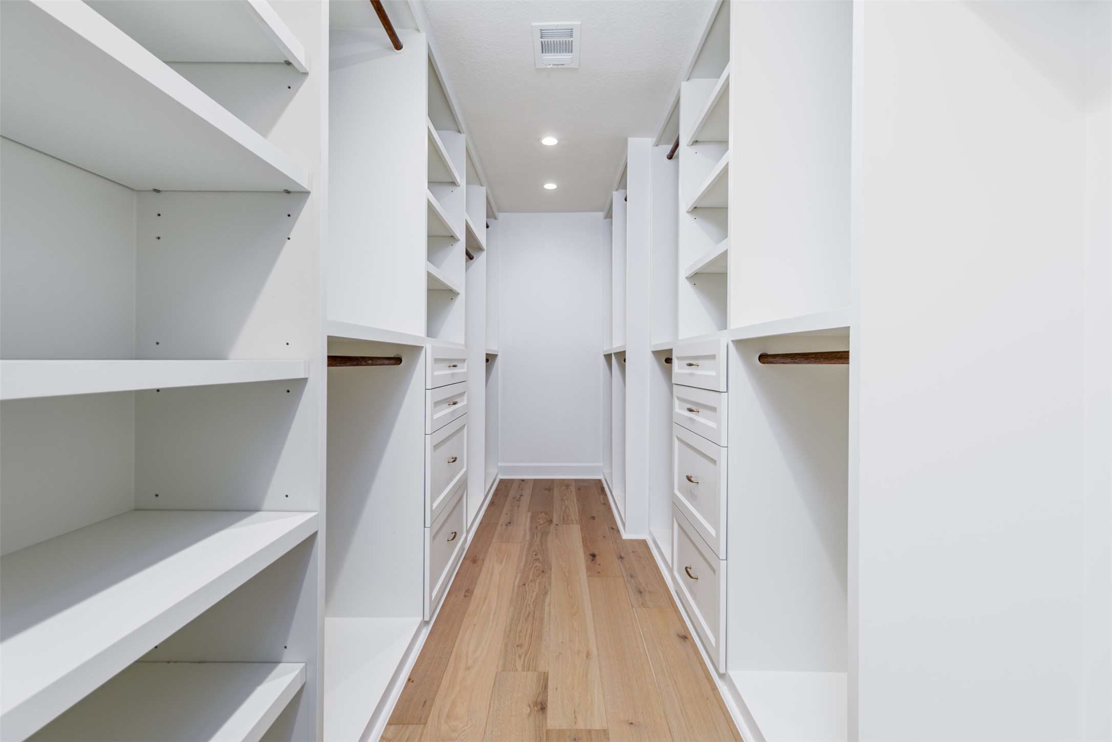 1535 Rutland Street Houston, TX 77008 - Photo 31 of 50 a hallway with white cabinets