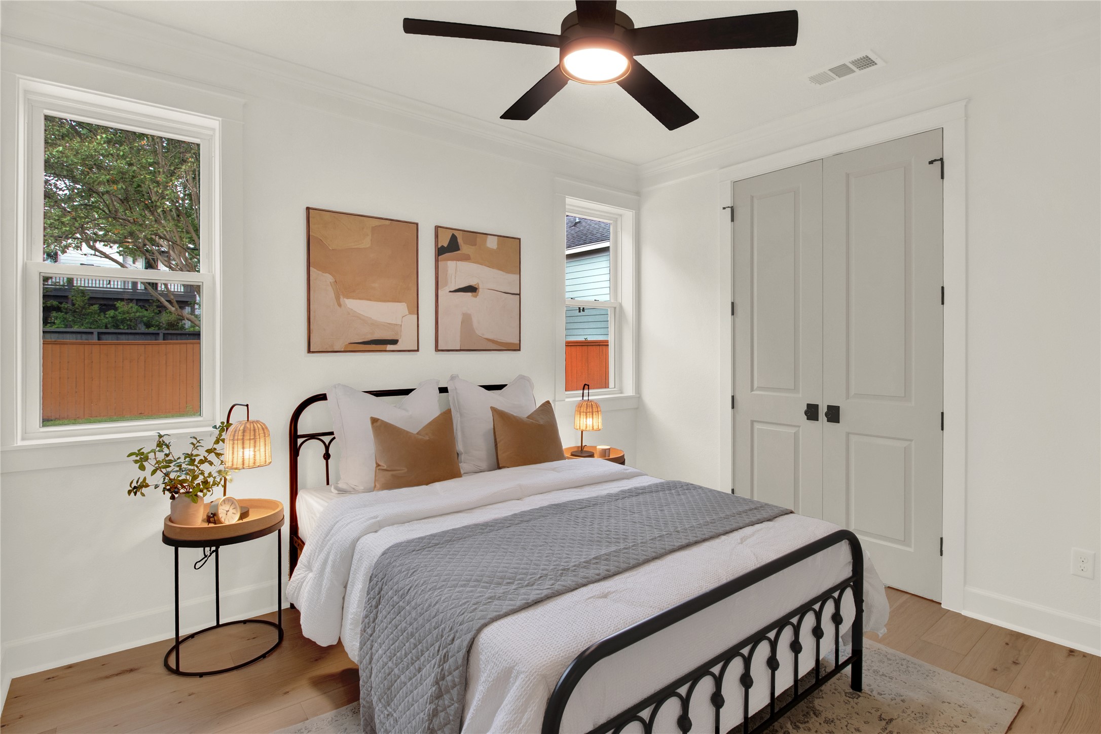 1535 Rutland Street Houston, TX 77008 - Photo 32 of 50 a bedroom with a bed and a painting on the wall