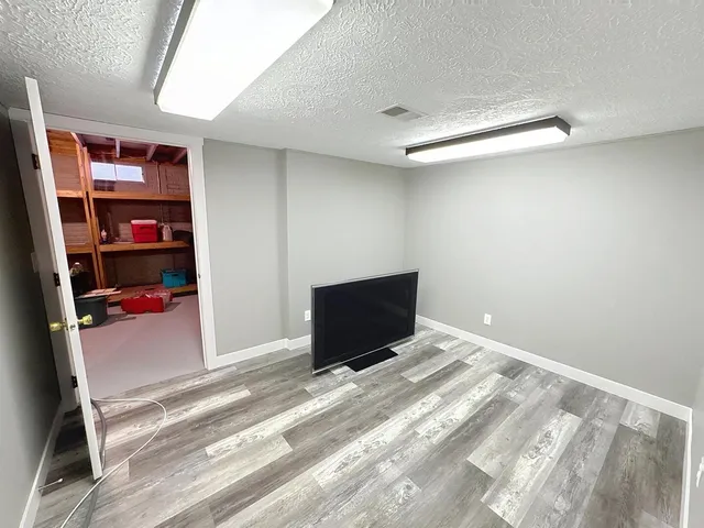 a room with closet and wooden floor