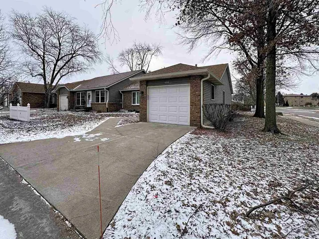 a house that has a tree in front of it