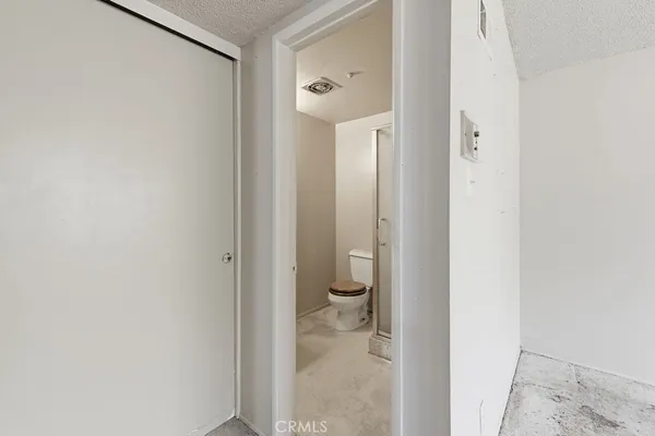 a bathroom with a glass shower door