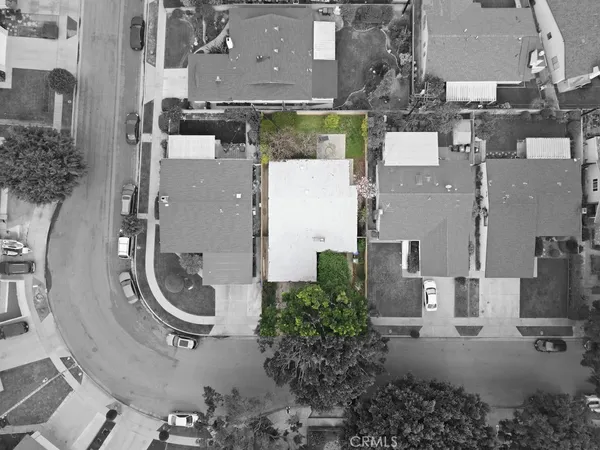 an aerial view of residential house with outdoor space and parking