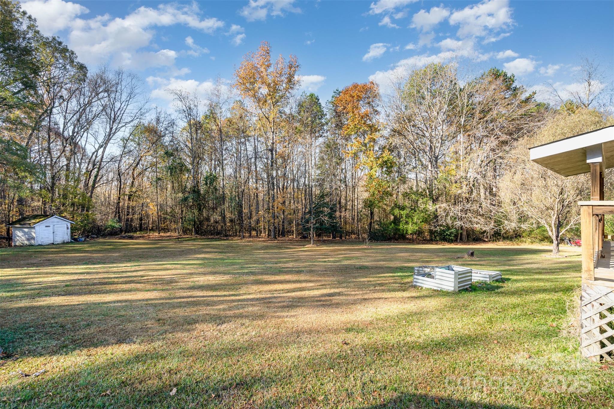 650 Rama Wood Drive Southeast Concord, NC 28025 - Photo 15 of 17 a view of a swimming pool with an outdoor space and seating area
