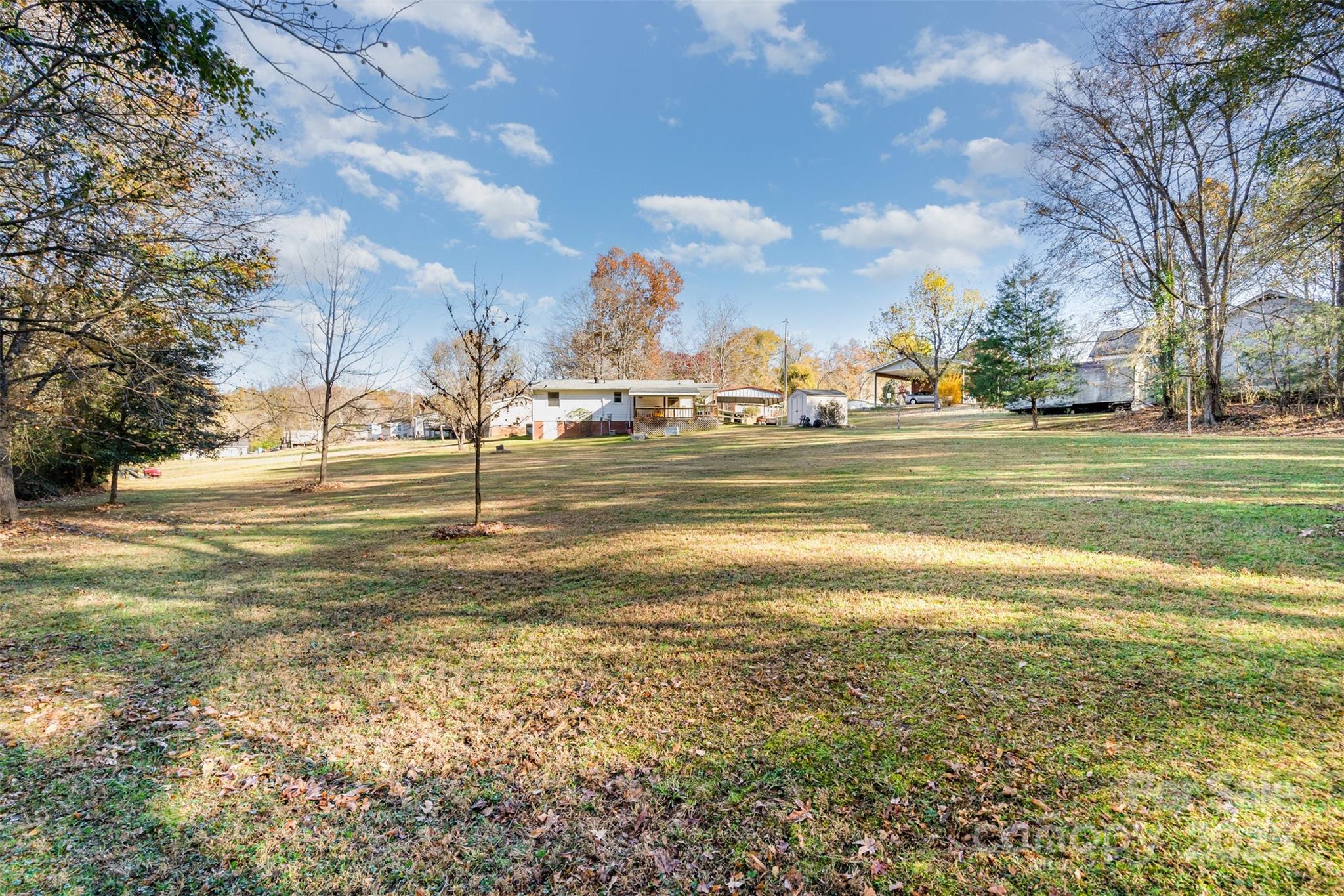 650 Rama Wood Drive Southeast Concord, NC 28025 - Photo 16 of 17 a view of a lake with a building