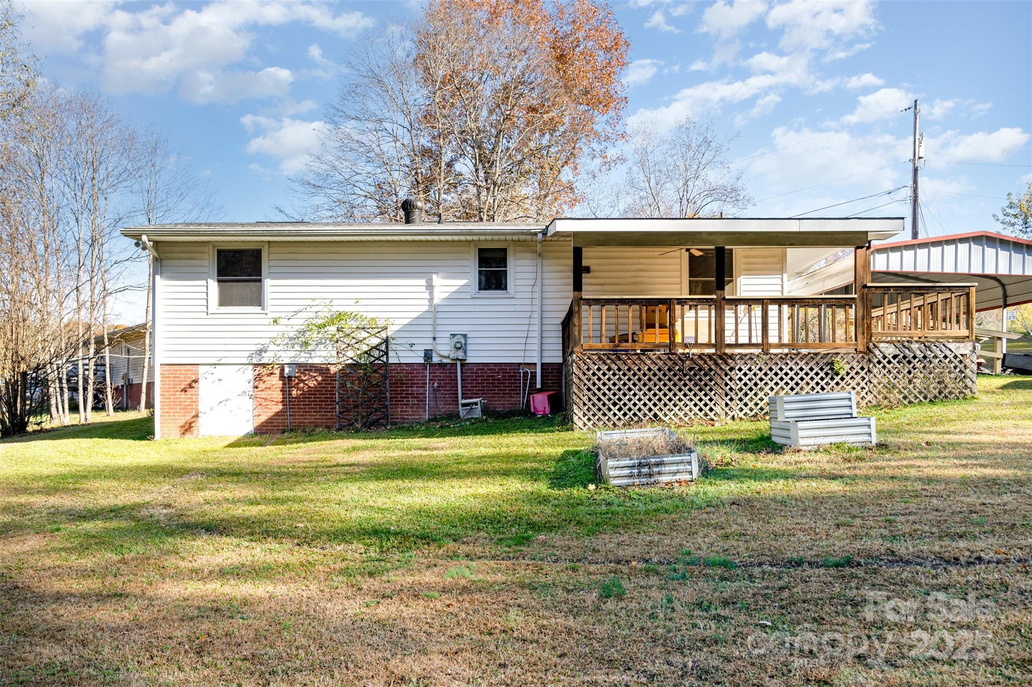 650 Rama Wood Drive Southeast Concord, NC 28025 - Photo 17 of 17 a front view of a house with a yard and garage