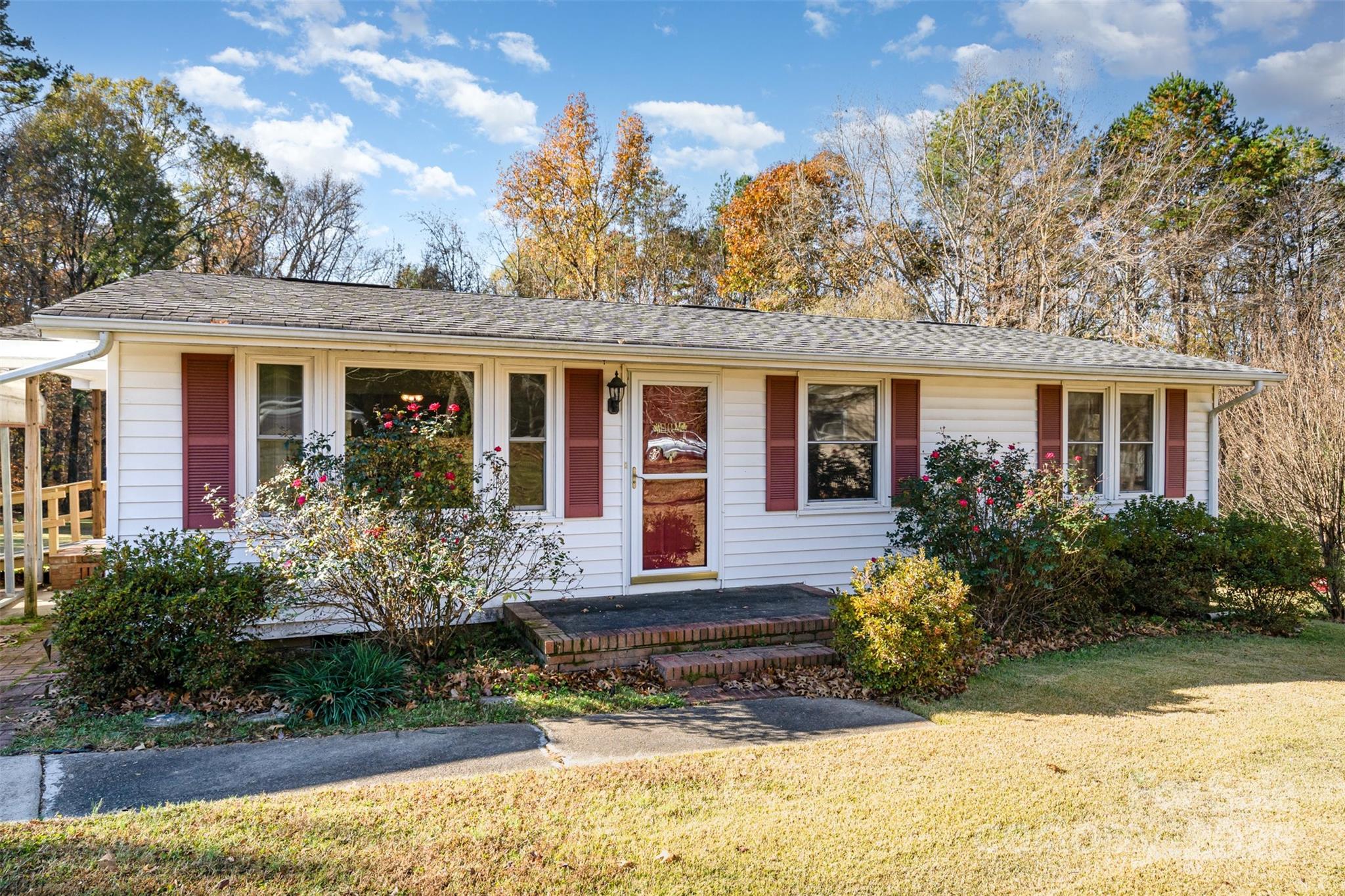 650 Rama Wood Drive Southeast Concord, NC 28025 - Photo 3 of 17 front view of a house with a yard
