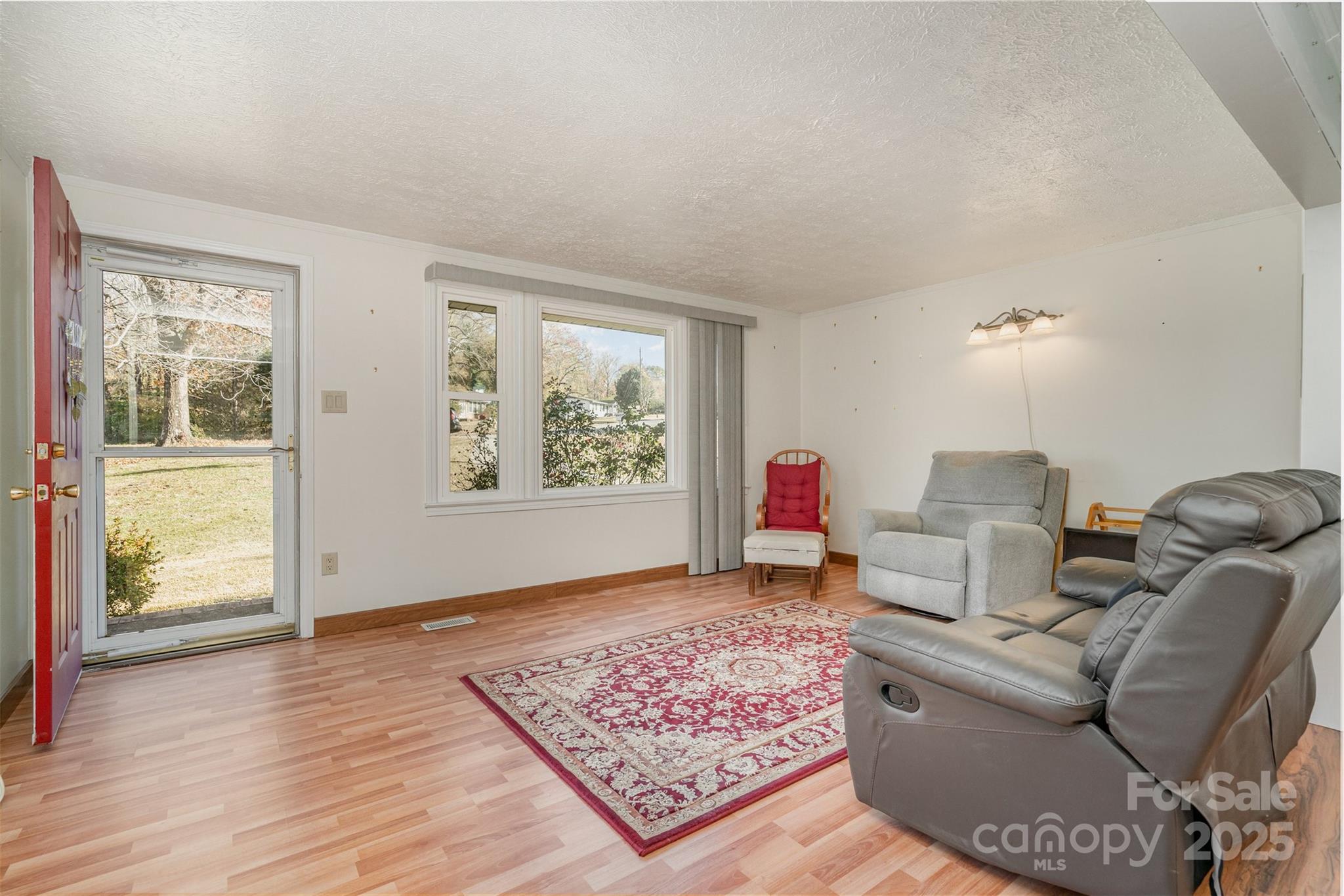 650 Rama Wood Drive Southeast Concord, NC 28025 - Photo 5 of 17 a living room with furniture and a window