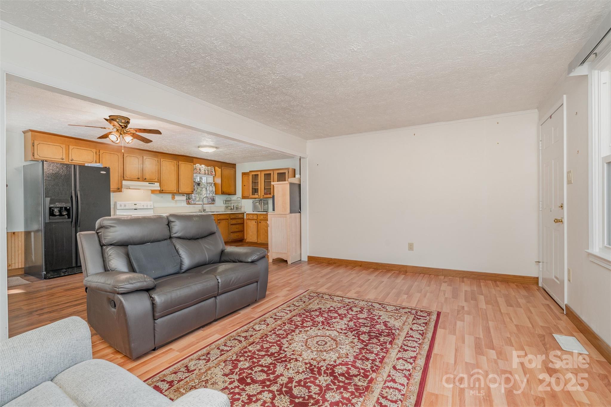 650 Rama Wood Drive Southeast Concord, NC 28025 - Photo 6 of 17 a living room with furniture and a rug