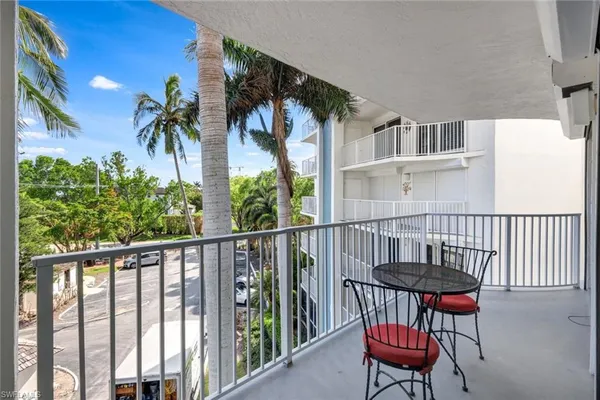 a view of a chairs and table in patio