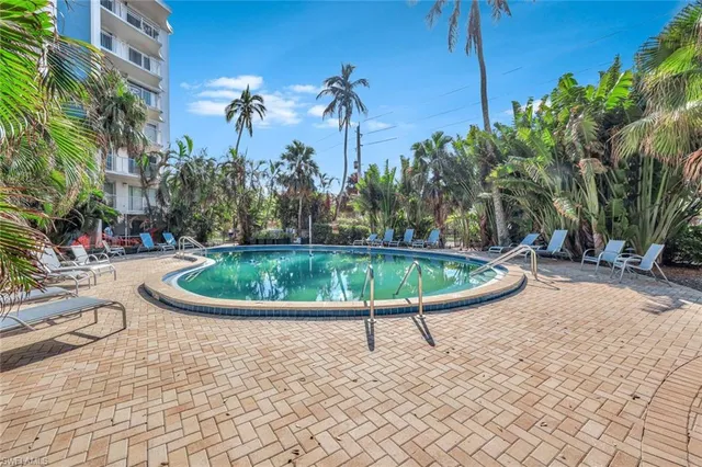 a view of a swimming pool with a patio