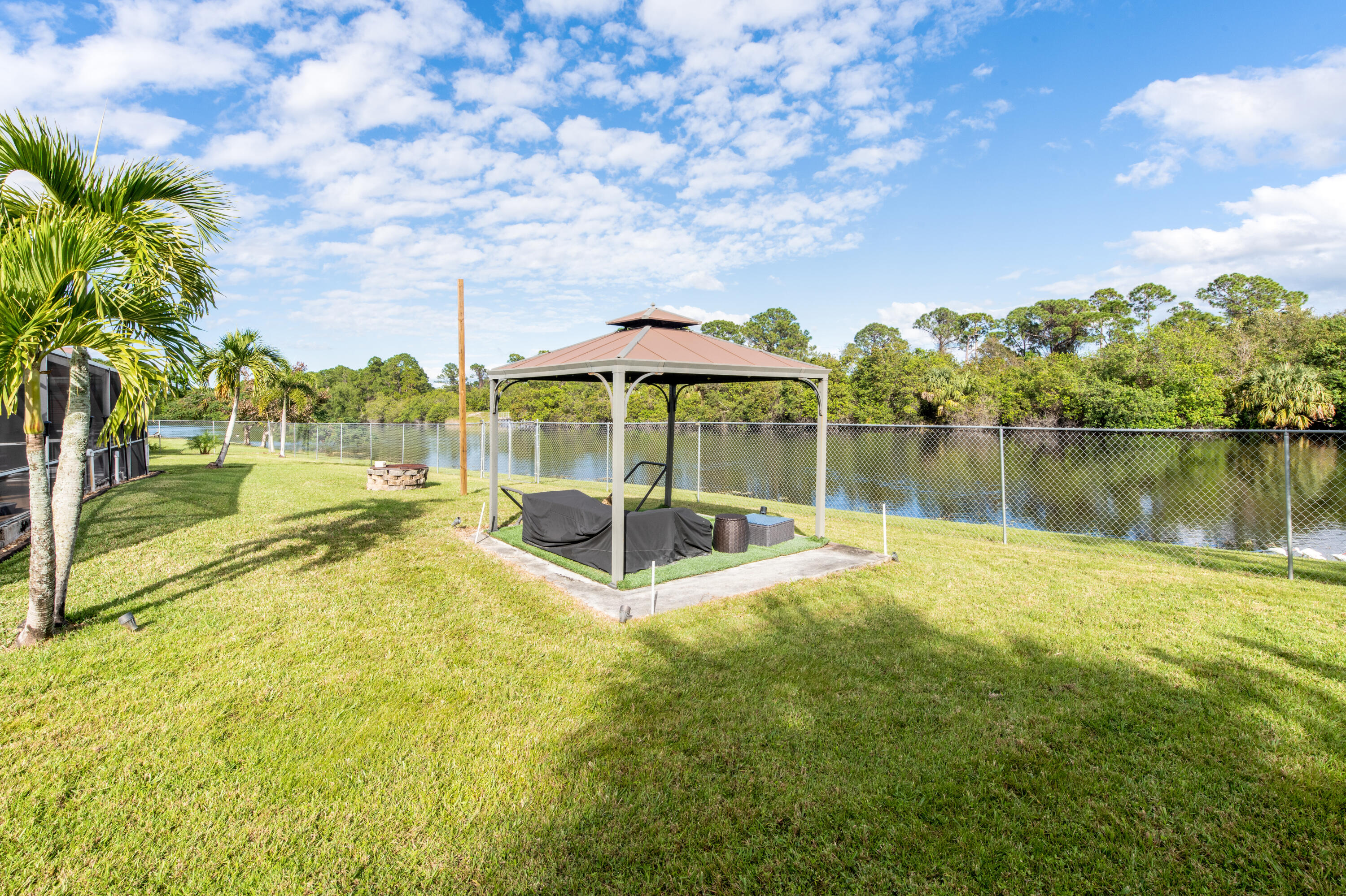 3523 Southwest Macon Road Port St. Lucie, FL 34953 - Photo 38 of 43 Back Yard Covered Lounge
