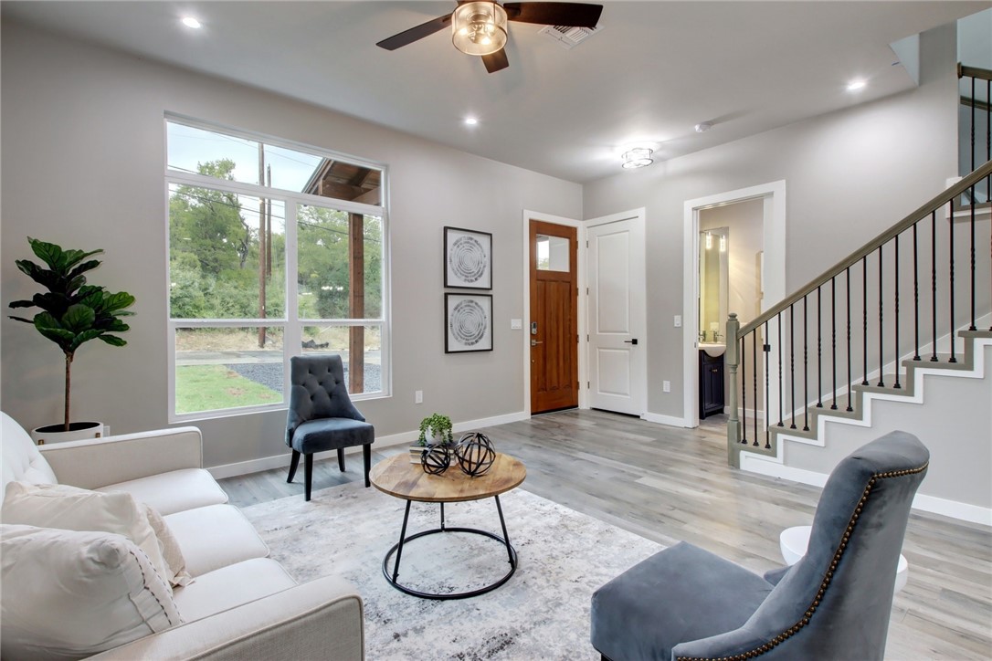 a living room with furniture and a large window