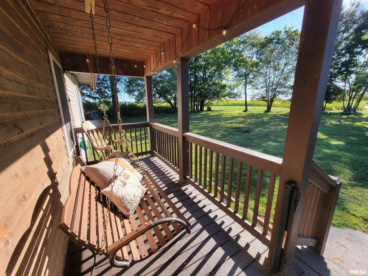 2517 Cherrybark Lane Flora, IL 62839 - Photo 16 of 99 a view of balcony with wooden floor and outdoor seating