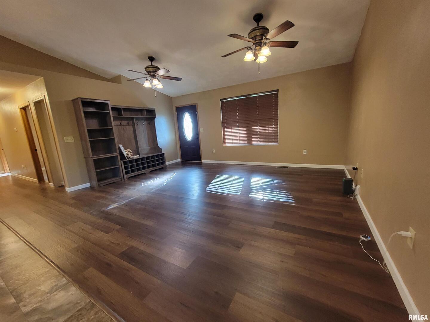 2517 Cherrybark Lane Flora, IL 62839 - Photo 3 of 99 wooden floor in an empty room with a window