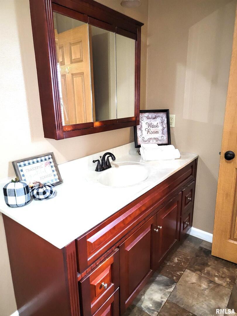 2517 Cherrybark Lane Flora, IL 62839 - Photo 65 of 99 a bathroom with a sink vanity and a mirror