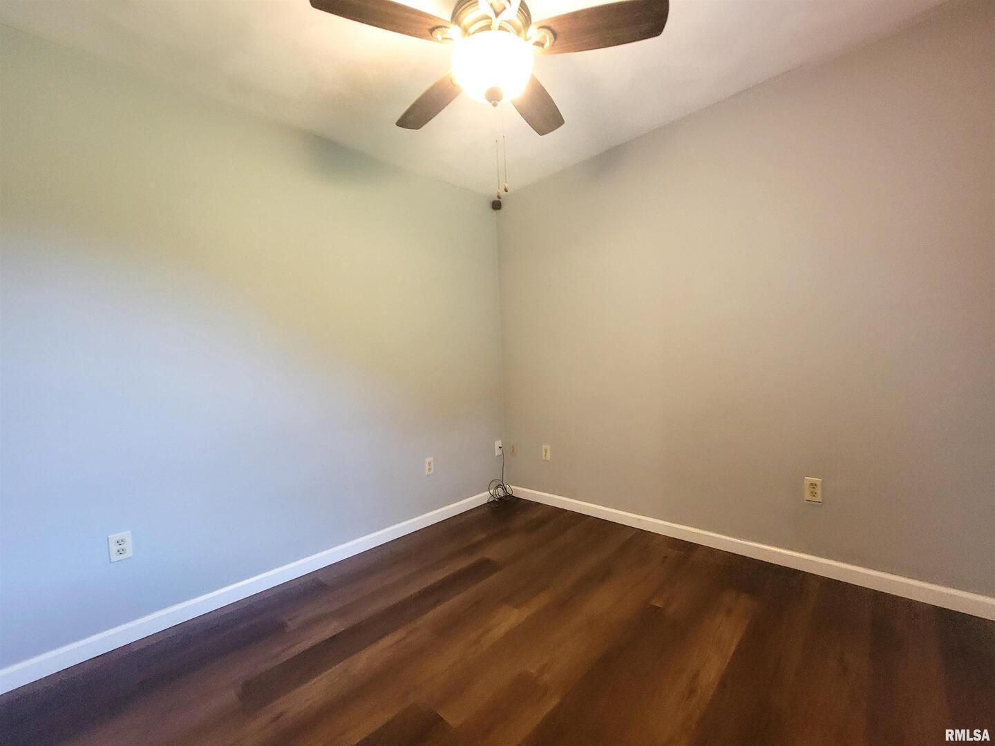 2517 Cherrybark Lane Flora, IL 62839 - Photo 82 of 99 a view of a room with wooden floor and fan