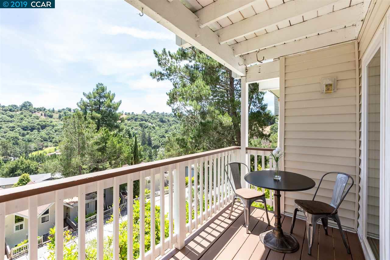 a view of a chair and table in the balcony