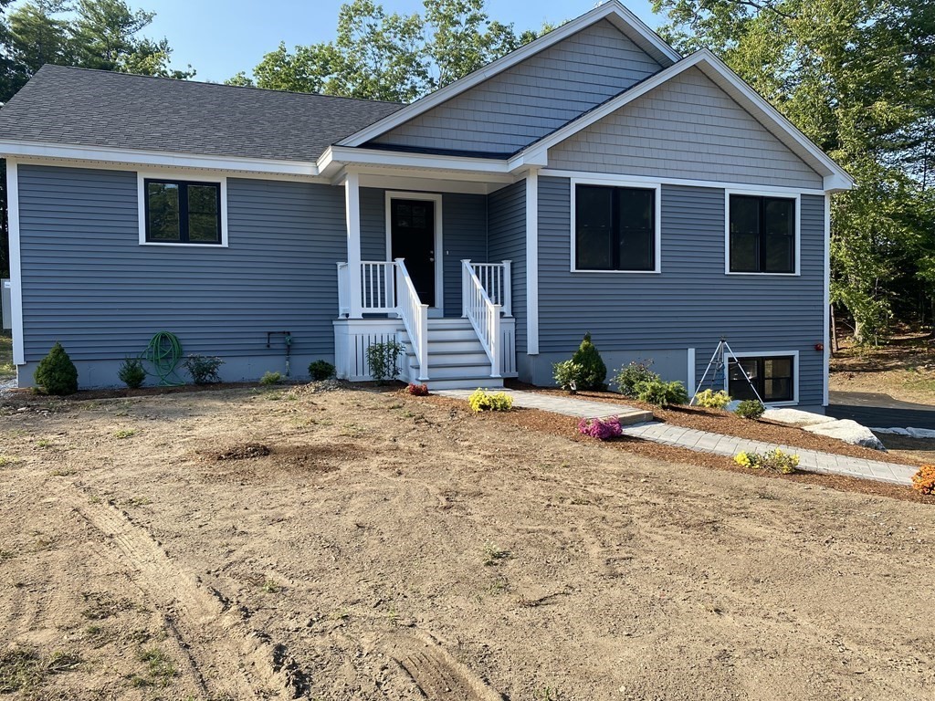 185 Kimball Road Amesbury, MA 01913 - Photo 3 of 24 a front view of a house with a yard