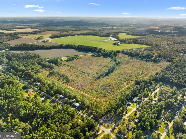 an aerial view of a houses with outdoor space