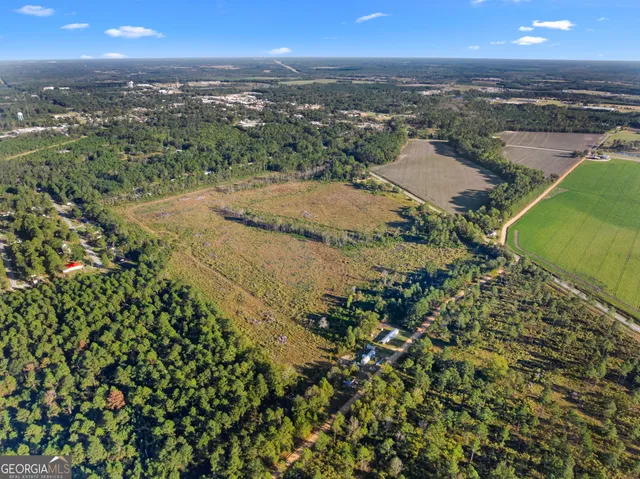 a view of a lake with houses in the back