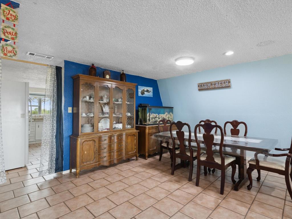 265 County Road 4374 Decatur, TX 76234 - Photo 14 of 32 a view of a room with lots of chairs and mirrors