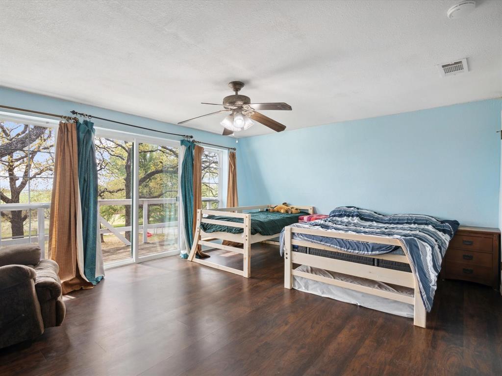 265 County Road 4374 Decatur, TX 76234 - Photo 29 of 32 a bedroom with furniture and windows