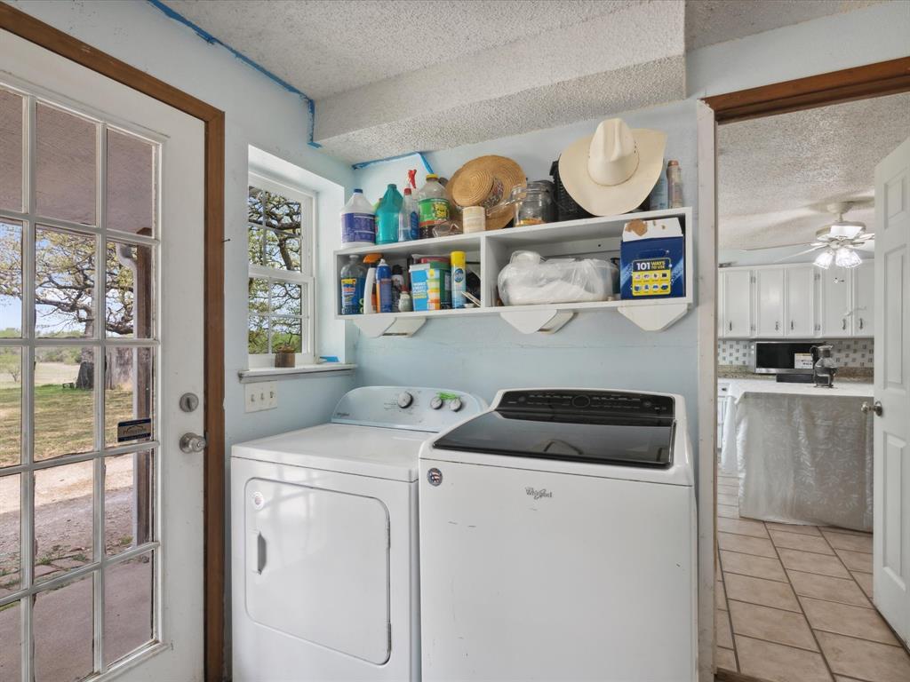 265 County Road 4374 Decatur, TX 76234 - Photo 31 of 32 a kitchen with a stove and cabinets