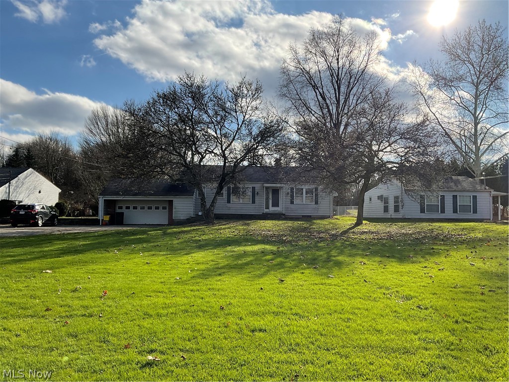 3295 McCartney Road Campbell, OH 44405 - Photo 2 of 25 3295 is house with garage.