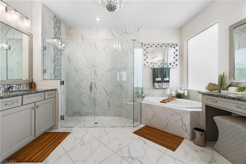 8936 Mustique Lane Naples, FL 34114 - Photo 14 of 29 a spacious bathroom with a double vanity sink toilet and shower