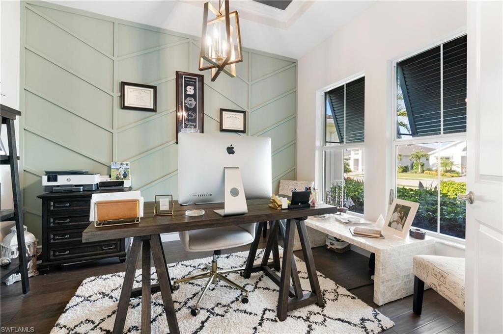 8936 Mustique Lane Naples, FL 34114 - Photo 20 of 29 a living room with furniture and a window