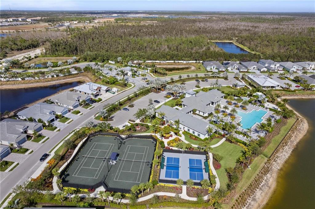 8936 Mustique Lane Naples, FL 34114 - Photo 27 of 29 an aerial view of residential houses with outdoor space