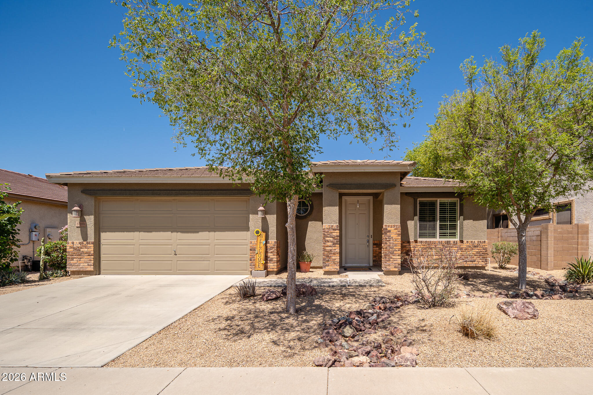 front view of a house with a yard