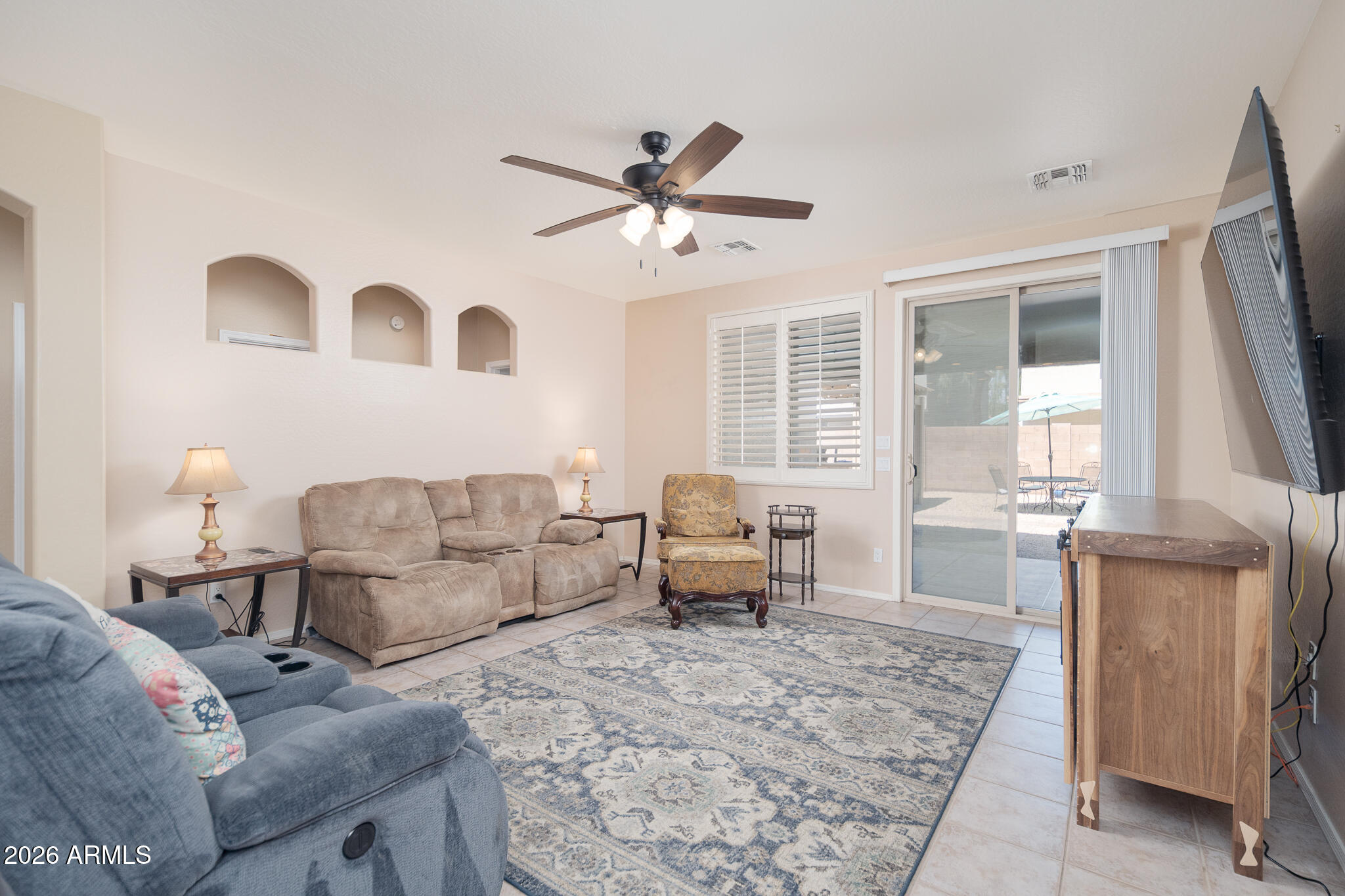 17284 West Madison Street Goodyear, AZ 85338 - Photo 13 of 34 a living room with furniture and a large window