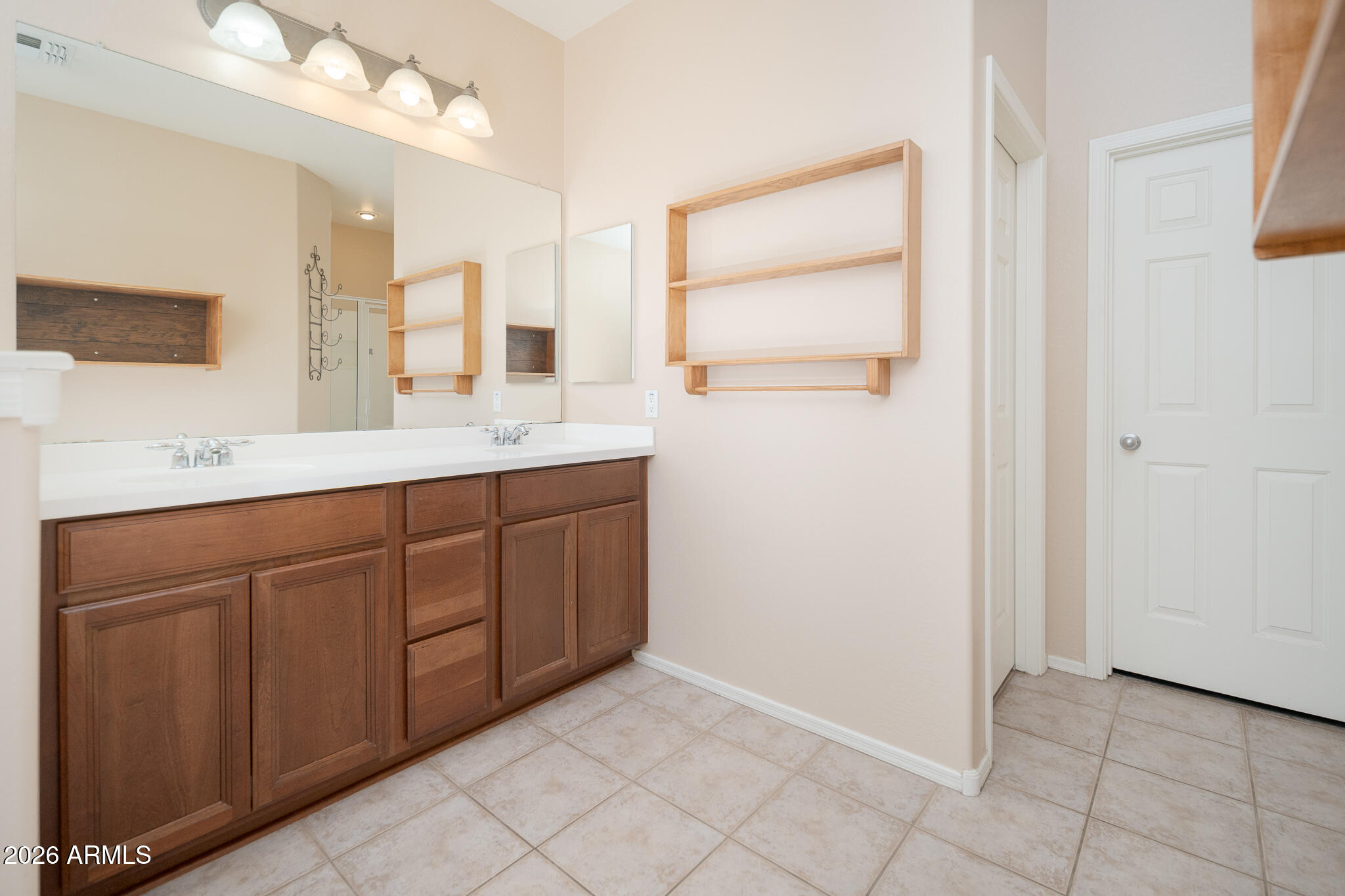 17284 West Madison Street Goodyear, AZ 85338 - Photo 18 of 34 a bathroom with a sink and a mirror