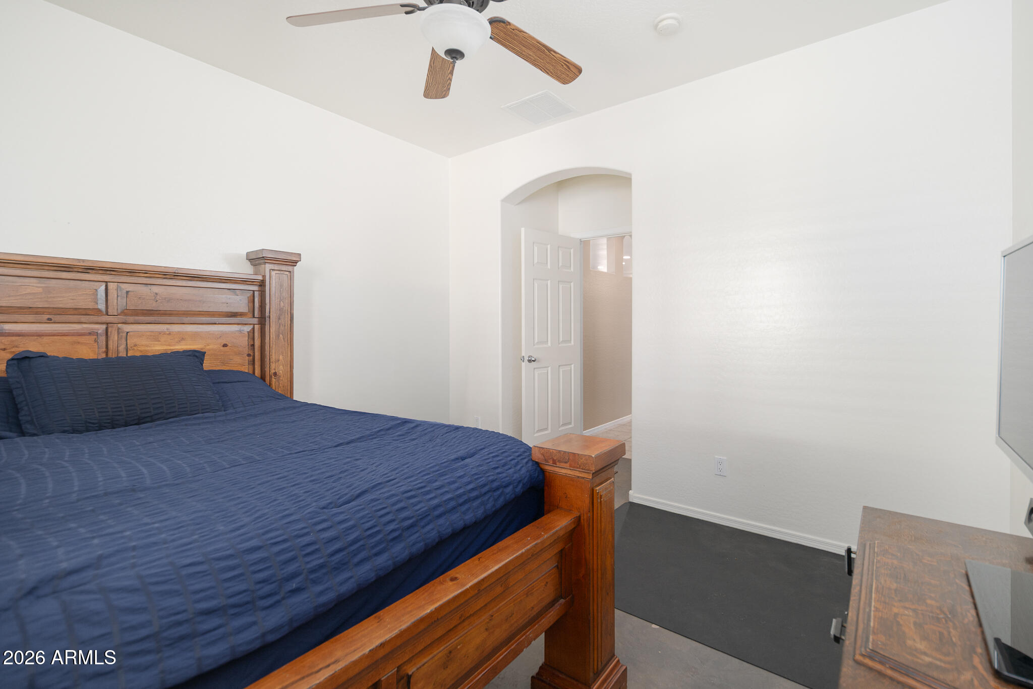 17284 West Madison Street Goodyear, AZ 85338 - Photo 23 of 34 a bedroom with a bed and a dresser
