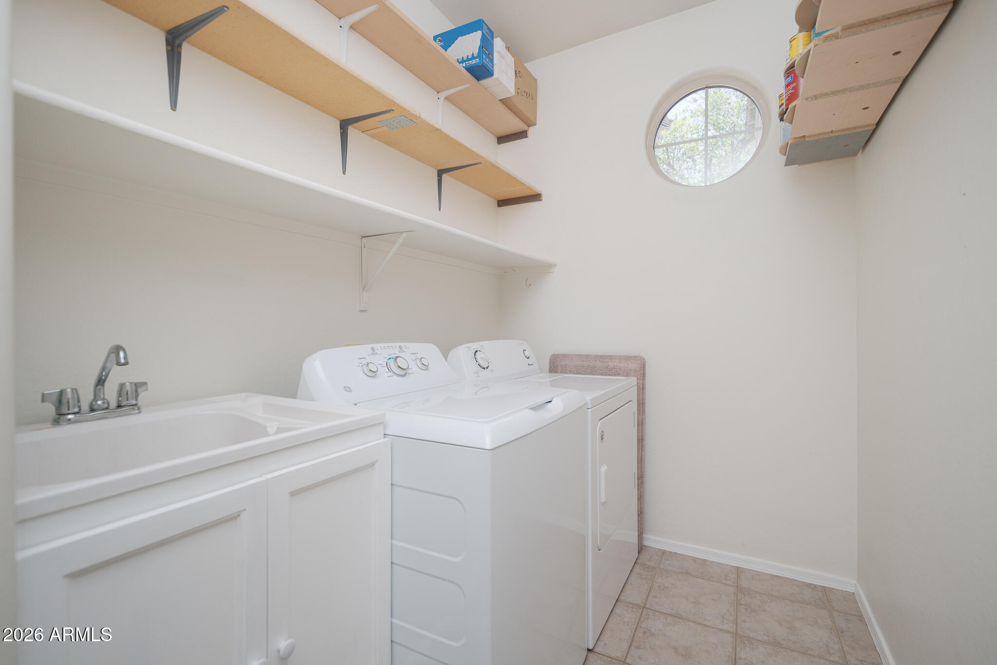 17284 West Madison Street Goodyear, AZ 85338 - Photo 26 of 34 a utility room with dryer and washer