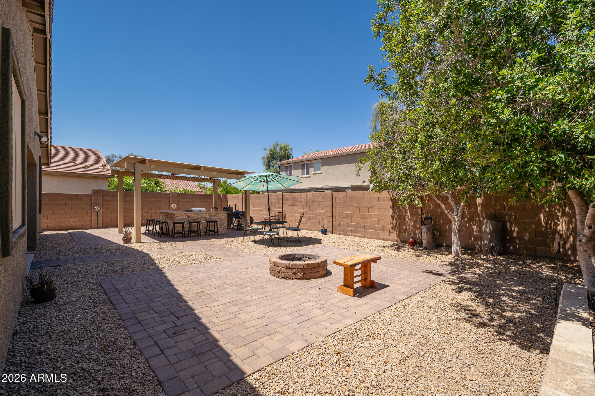 17284 West Madison Street Goodyear, AZ 85338 - Photo 27 of 34 a view of a backyard with sitting area
