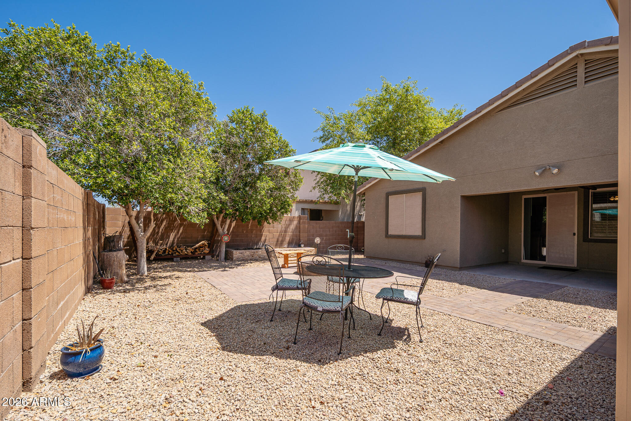 17284 West Madison Street Goodyear, AZ 85338 - Photo 30 of 34 a building outdoor space with patio furniture and white umbrellas