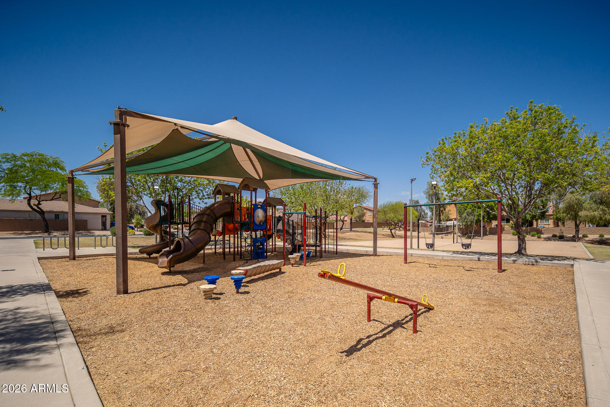 17284 West Madison Street Goodyear, AZ 85338 - Photo 31 of 34 a view of a park with swings