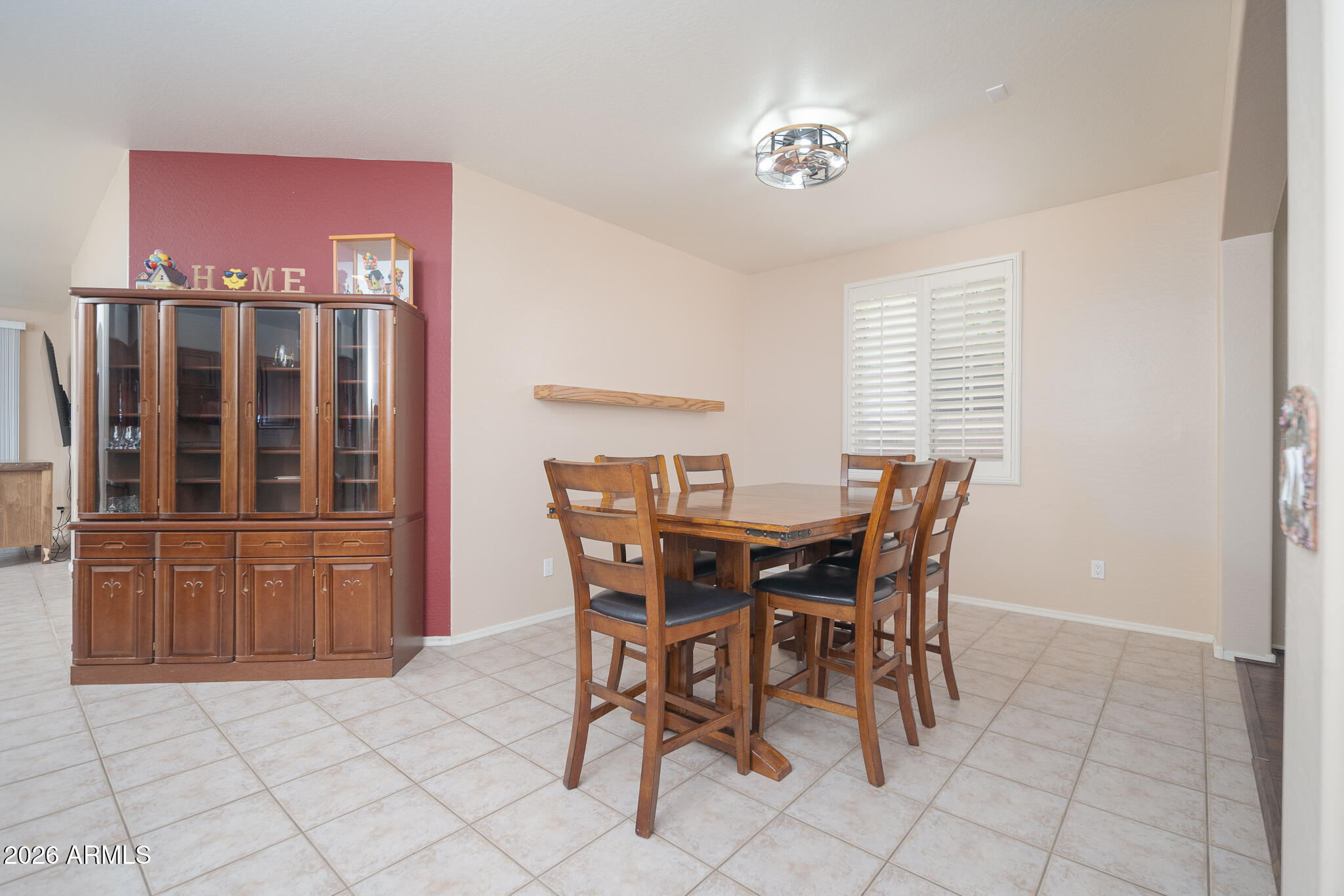 17284 West Madison Street Goodyear, AZ 85338 - Photo 8 of 34 a view of a dining room with furniture and chandelier