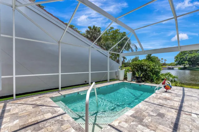 a view of a lake with a houses in the background