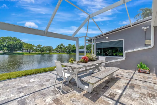a view of a lake with houses in the back