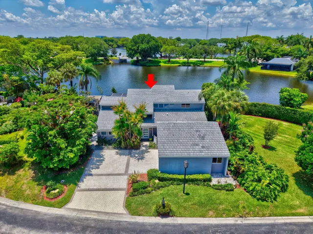 a bedroom with a bed and a flat screen tv on dresser