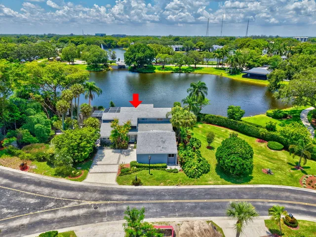 a bathroom with a sink and mirror with toilet