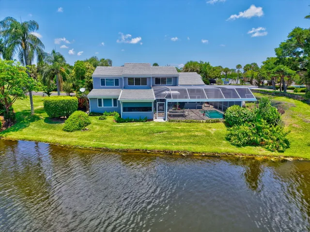 a living room with furniture and baby painting on the wall