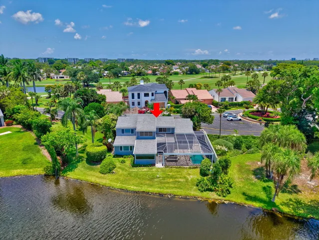 a living room with lots of furniture and chandelier